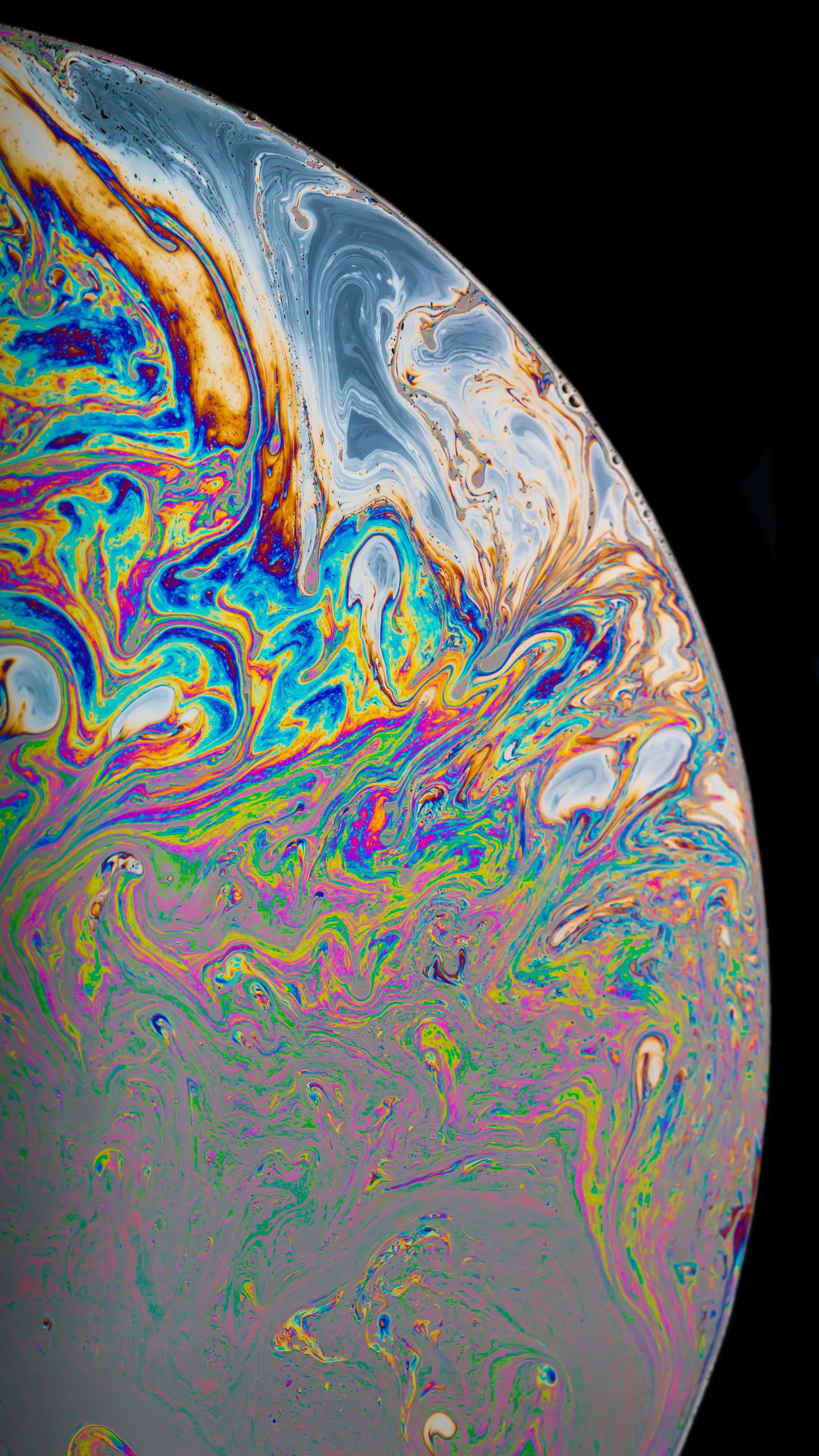 苹果手机系统自带的炫彩液体星球的手机壁纸